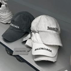 three hats are sitting on top of a table