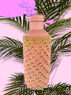 a crocheted bottle cover is hanging from a palm tree with a pink background