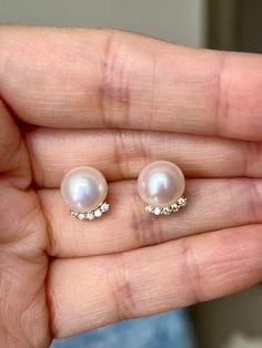 Discover the enchanting beauty of these top-grade freshwater pearl earrings, boasting a perfectly round shape that exemplifies their flawless craftsmanship. These white pearls, with a subtle yet captivating pink overtone, measure approximately 9-9.5mm in diameter, offering a symphony of elegance and grace. Each pearl is set in high-quality S925 sterling silver, known for its durability and purity, and is delicately plated with 18K gold, enhancing its allure with a touch of opulence. The combination of the pearls' spherical perfection and the luxurious gold plating makes these earrings a quintessential accessory for those who seek sophistication and timeless charm in their jewelry collection. Freshwater Pearl Earrings, Freshwater Pearls Earrings, Jewelry Earrings Hoops, Gold Plated Sterling Silver, Gold Plating, Pearl White, Round Shape, Fresh Water, Freshwater Pearls