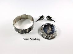 Siam Sterling Silver Vintage Parure Vintage 1940s Sterling Art Deco Formal Jewelry With Screw Back, Formal Art Deco Jewelry With Screw Back, Formal Sterling Silver Jewelry With Screw Back, Vintage Black Enamel Bracelet Jewelry, Vintage Black Enamel Bracelet, Classic Sterling Silver Jewelry With Black Enamel, Traditional Black Hallmarked Jewelry, Collectible White Gold Brooch Jewelry, Collectible White Gold Brooch