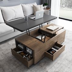 a modern coffee table with drawers underneath it