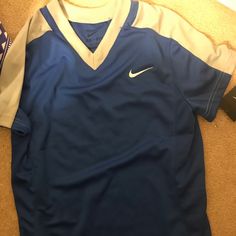 New With Tags Sporty Blue Shirt For Sports, Blue Short Sleeve Tops For Team Spirit, Nike Blue Casual Shirt, Blue Sporty V-neck T-shirt, Nike Casual Blue Shirt, Nike Casual V-neck Top, Casual Blue Nike Shirt, Nike Blue Tops For Spring, Casual Blue Sports Shirt