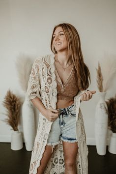 Add a touch of western chic to your wardrobe with our Long Lacey Crochet Cardigan. This super cute cardigan exudes fun and playful vibes, making it a perfect addition to any concert or Sunday brunch outfit. Pair it with a crop top or graphic tee for an effortlessly stylish look. Trendy Cotton Beach Outerwear, Casual Open Knit Outerwear For Summer, Open Knit Top With Open Front For Spring, Open Front Open Knit Top For Day Out, Spring Cotton Open Knit Outerwear, Trendy Fall Beach Cardigan, Trendy Spring Festival Cardigan, Summer Open Front Open Knit Outerwear, Summer Open Knit Outerwear With Open Front