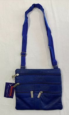 Marshal Wallet Brand Genuine Leather Blue Purse Crossbody. Condition is new with tags. There is a slight stitching defect on the back just above the zipper; see pics. Shipped with USPS first class. Colors vibrant, item free from stains or damage unless noted above. Measurements are in inches laying flat. See pics. - Our items are all carefully examined, measured, photographed and stored in a smoke free/Pet friendly environment. Shipping: I am not responsible for undeliverable addresses. For My I Blue Travel Wallet With Zipper Pocket, Blue Leather Bag With Zipper Pouch, Blue Wallets With Zipper Closure For Daily Use, Blue Crossbody Travel Wallets, Blue Wallet With Zipper Closure For Daily Use, Blue Rectangular Wallet With Zipper Pocket, Blue Wallets With Zipper Pocket For Everyday Use, Blue Crossbody Wallet With Cell Phone Pocket, Blue Wallet With Zipper Pocket For Daily Use