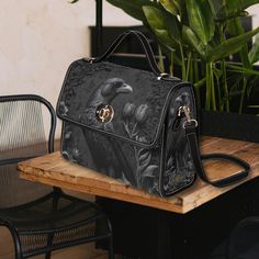 Our gothic crow canvas satchel bag is the perfect must-have accessory. Accented with black PU leather trims and with two interior pockets. Carry as a top handle bag or use the adjustable strap for carrying on the shoulder. The perfect size for carrying your essentials on the go. Made from quality materials, this dark gothic style bag features a secure magnetic snap closure and adjustable shoulder strap. Please note that the fabric is a canvas textured material.  *Made from high-grade waterproof Gothic Crossbody Travel Bag, Gothic Black Satchel, Gothic Style Travel Satchel Shoulder Bag, Gothic Rectangular Bags For Everyday Use, Gothic Shoulder Bag Satchel For Travel, Gothic Satchel Bag For Gift, Gothic Satchel Bag As Gift, Gothic Rectangular Satchel For Daily Use, Gothic Satchel Gift Bags