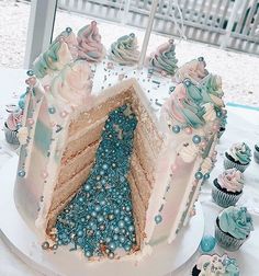 there is a cake that has been decorated with blue and pink icing