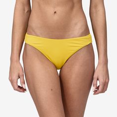 Classic higher-rise, high-hip bikini bottoms with minimal coverage made of recycled nylon/spandex (solids and jacquards) or recycled polyester/spandex jersey (prints); hidden elastic at the waist and leg openings provides excellent slip-resistance. Made in a Fair Trade Certified™ factory. | Patagonia Women's Upswell High Rise Bikini Bottoms in Shine Yellow, Large - Surf Bikinis & Swimwear - Recycled Nylon/Recycled Polyester Surf Bikinis, Patagonia Women, High Hips, Design Minimal, Patagonia Womens, Winter Sale, Body Size, Women Swimsuits, Fair Trade