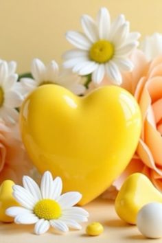 a yellow heart surrounded by daisies and other flowers