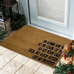 a dog is sitting on the front door mat that says, i come home from christmas