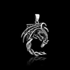 Sterling Silver Dragon Pendant with Oxidized Finish Pendant Height (including loop, excluding bail): Approx 36mm Please other photos for size reference Sterling Silver Necklace Chains also available as add on.  Please see sizing chart and select length preference from Options list Shipping Policy:  Please see FAQs below Silver Elephants, Sterling Silver Cross Pendant, Silver Cross Pendant, Silver Dragon, Elephant Pendant, Sterling Silver Chain Necklace, Dragon Pendant, Sterling Silver Cross, Hamsa Hand