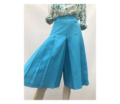 "1970s blue turquoise pleated skirt pants  size eu 38- uk 10 - us  6  label : ASCOT paris polyester  no lining  M E A S U R E M E N T  S waist : 64cm //25.2\" inner leg :38cm /:15\" height :66cm //26\" hips : 94cm //37\" excellent vintage condition" Fitted Knee-length Pleated Skirt For Spring, Blue Pleated Waist Bottoms For Work, Summer Pleated Fitted Pants, Fitted Pleated Summer Pants, Fitted High Waist Pleated Skirt With Belt Loops, Short Length Pleated Skirt, Vintage Non-stretch Bottoms For Spring, Summer Pleated Full-length Bottoms, Pleated Full-length Summer Bottoms