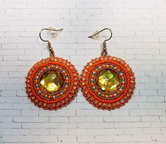 Orange multicolored beveled cabochon earrings with seed beads, rhinestone banding and earwires. Multicolor Beaded Crystal Earrings, Multicolor Czech Glass Beaded Earrings For Party, Orange Beaded Round Earrings, Seed Beaded Earrings, Cabochon Earrings, Nov 6, Seed Bead Earrings, Beaded Earrings, Seed Beads