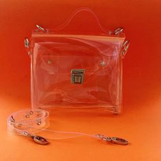 "Please note: We are safe and we fulfill the order as normal, in accordance with the declared deadlines. Ghost bag, transparent messenger, medium pvc satchel, vegan handbags, clear crossbody, gift for rave girl, easy to disinfect, premium  Standard Shipping = Express Shipping by Fedex Dimensions:  23 x 20 x 5 cm / 10,24 x 7,87 x 1,97 inch strap 2 cm( 0,8 inch)  and regular max 140 cm ( 56 inches) Made of thick, crystalline, flexible PVC. A large handbag city , type of messenger bag/ office bag .  Medium transparent messenger bag with solid straps to my fascination with the universe transparent .You can complete your harmony as putting some compatible things with your daily dress into the transparent bag and you are ready to go! It's also good when going through airport security. The unique Ghost Bag, Bag Transparent, Everyday Handbag, Rave Girl, Jelly Bag, Vegan Handbags, Office Bag, Transparent Bag, Large Handbags