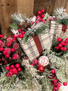 christmas decorations with red berries and evergreens