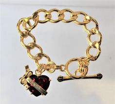 Gorgeous Charm Bracelet with a large red heart. This bracelet is stunning. This is a juicy couture remake, not an original. The bracelet is 7.5 in. long gold curb chain with a stick and circle clasp. Thrift Jewelry, Man Fits, Bad Man, Gold Curb Chain, Henna Tattoo Designs Hand, Red Charm, Red Bracelet, Birthday Fits, Diy Wire Jewelry