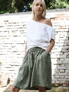 "Short linen skirt with delicate, decorative pleats on the front. Relaxed fit with mid waist. Gorgeous, elegant and natural. The simple cut, perfect for any figure. Pair with our linen tops. Midi and long versions also available. Made in our workshop for you. Authentic hand-made. DETAILS: - 100% washed, softened, light linen. - Includes one linen skirt - The images above show the eucalyptus colour - Wide waistband ensures comfort - Pockets on the sides - Short slits on the sides - Shrinkage afte Short Linen Skirt, Linen Tops, Linen Short, Skirt With Pockets, Linen Jacket, Skirt Skirt, Linen Skirt, Style Expert, Linen Top