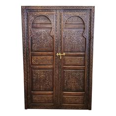 an ornate wooden door with carvings on it