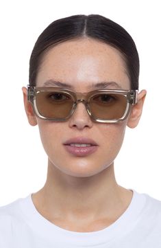 Smooth rectangular frames define these sleek sunglasses fitted with smoky-tinted lenses. 52mm lens width; 20mm bridge width; 145mm temple length 100% UV protection Plastic Imported