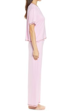 Short-sleeve pajamas in a blissfully soft knit you'll want to live in are traced with colorful embroidery. 21 1/2" top length; 28" inseam; 10 1/2" leg opening; 11 1/2" front rise; 14 1/2" back rise Top has crewneck; short sleeves Pants have drawstring waist 95% rayon, 5% spandex Machine wash, line dry Imported Feminine Crew Neck Top For Loungewear, Comfortable Pink Tops For Pajama Party, Spring Short Sleeve Nightgown For Loungewear, Spring Loungewear Nightgown Relaxed Fit, Spring Sleepwear Short Sleeve Stretch, Spring Sleepwear With Stretch And Short Sleeves, Pink Tops For Loungewear, Spring Stretch Sleepwear With Short Sleeves, Stretch Short Sleeve Tops For Sleepover