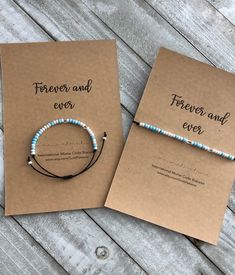 two personalized bracelets are sitting on top of a card that says forever and ever