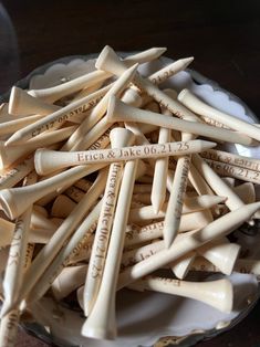 a bowl filled with lots of wooden sticks