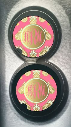 two matching monogrammed car coasters with pineapple design