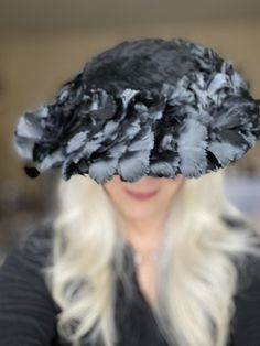 STUNNING vintage Lucila Mendez black saucer hat consisting of a rich fur felt base, with an under-cap to secure it to your head, and a brim covered with feathers and satin "feathers"- it looks like a bird cocktail party!This vintage Lucila Mendez creation is a knockout and measures 15" across.This vintage designer saucer hat is ready for your next vintage affair, church, reenactors event, vintage fashion show, wedding hat, funeral hat, and great for Movie, Tv and theatre costume. Or maybe even t Vintage Fashion Show, Saucer Hat, Miss Kitty, Wedding Hat, Theatre Costumes, Vintage Fits, Wedding Hats, Black Feathers, Vintage Designer