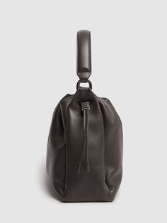 Find BRUNELLO CUCINELLI Glove Napa Leather Top Handle Bag on Editorialist. This BRUNELLO CUCINELLI bag is crafted from napa leather and features a top handle and a detachable adjustable strap. The bag also has a drawstring closure, an internal zip pocket, and a printed logo on the front. The dimensions of the bag are 20cm in height, 25cm in width, and 9cm in depth. The adjustable strap has a drop of 52cm and the top handle has a drop of 9cm. Designer Pouch Hobo Bag With Detachable Handle, Luxury Brown Bucket Bag With Top Carry Handle, Luxury Bucket Bag With Top Carry Handle For Business, Luxury Business Bucket Bag With Top Carry Handle, Luxury Evening Hobo Bag With Top Carry Handle, Designer Hobo Bag With Detachable Strap And Round Handle, Formal Bucket Shoulder Bag With Removable Pouch, Evening Hobo Bag With Top Carry Handle, Elegant Bucket Hobo Bag With Detachable Handle