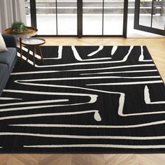 a black and white area rug in a living room