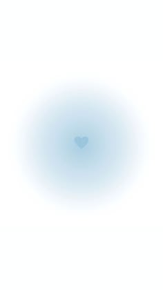 a blue circle with a heart in the middle on a white background that appears to be blurry