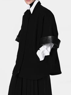 Oversized cape coat with half sleeve with leather cuff. Collared and button down front. Model is wearing MINUSEY ONE SIZE. ✔️ Free worldwide express shipping over $100✔️ Loved by 6,500+ customers✔️ Limited edition collections, maximum style⠀⠀⠀⠀⠀⠀⠀⠀⠀Stay ahead of the trend with can’t-find-anywhere-else staples. Your closet will thank you 💕 MINUSEY ONE SIZE = EU 34-38 ,US 2-6 10% Cashmere / 80% Wool / 10% Nylon Dry clean Made in Korea - Model Height: 172cm/5'7" (US 2, EU 34) Modern Black Outerwear With Button Cuffs, Modern Workwear Cape Outerwear, Modern Cape Outerwear For Work, Modern Cape-style Workwear Outerwear, Modern Fall Cape For Workwear, Modern Cape For Workwear In Fall, Avant-garde Black Outerwear For Work, Workwear Collared Outerwear With Snap Cuffs, Collared Outerwear With Snap Cuffs For Work