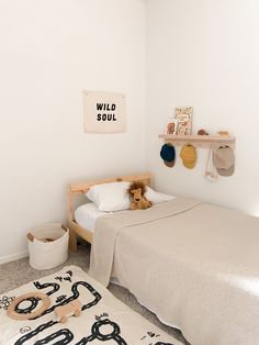 a child's bedroom with a bed and toys