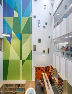 the interior of a library with bookshelves and shelves