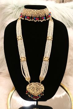 Handcrafted with love to give a real traditional look for this set beautifully studded with jadau stones and pearls give a royal look. Includes: Choker, Rani Haar, Earrings, and Tikka Elegant Traditional Wear With Stone Work For Festivals, Bollywood Style Bridal Necklace For Festive Occasions, Elegant Hand Set Traditional Wear For Diwali, Elegant Traditional Wear With Intricate Design For Eid, Bollywood Style Pearl Chain Jewelry Sets For Diwali, Elegant Meenakari Bridal Sets For Eid, Elegant Heavy Bridal Necklace For Eid, Elegant Traditional Wear With Tilla Drape, Elegant Traditional Wear With Tilla