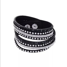 IN STOCK! Black Suede Rhinestone Studded Choker This is one of my all time favorites!  Chic and stylish suede wrap bracelet in black with rhinestones and studs.  Length is 14.5" - perfect for layering as a bracelet or wearing as a choker.  Versatile and so cool!  I wear mine all the time.  More colors on order, but this one is IN STOCK! Jewelry Bracelets Black Crystal Bracelets With Rhinestones, Adjustable Black Crystal Bracelet With Rhinestones, Adjustable Black Crystal Rhinestone Bracelet, Black Crystal Bracelet For Party, Black Crystal Party Bracelet, Leather Wristbands, Rhinestone Studs, Rhinestone Bracelet, Bracelet Bangle