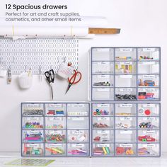 there are several drawers in the refrigerator with scissors and other items hanging on the wall