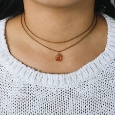 This is a raw citrine choker which is wrapped with our high quality wire. Fully adjustable with a sliding pearl on our premium cotton cord.  The raw citrine crystal reminds us of the bright, warm sun and the vitality of life. Its bright yellow colour and radiant clarity stand for joie de vivre, self-assurance and strength.  ✺ COLOR ✺  Three different colors are available for waxed cotton cord: -Beige (natural color) -Brown -Black and two colors for wire:  -Gold (gold Filled) -Silver (Sterling Si Adjustable Hand Wrapped Necklaces For Layering, Adjustable Citrine Necklaces For Healing, Adjustable Amber Citrine Necklace, Adjustable Wire Wrapped Necklaces For Layering, Adjustable Orange Choker Jewelry, Orange Choker Jewelry For Gift, Adjustable Wire Wrapped Crystal Choker, Handmade Adjustable Crystal Necklaces For Layering, Handmade Adjustable Crystal Necklace For Layering