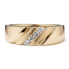 a yellow gold ring with three diamonds on it's center and two sides in the middle