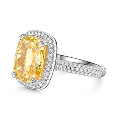 Resplendently styled with a yellow center stone, the engagement ring is designed to shine from every angle. The glittering centerpiece is complete with a halo of small round stones and shimmering stone-set shoulders, which enhance the brilliance of this chic design. Infused with elegance and effulgence, it enriches your lady's beautiful look and charming personality. Make it a perfect engagement ring and honor your flaming love.Carat Weight: 9.715 ctStone Size: 10*12 mmStone Type: Jeulia® StoneN Cushion Cut Yellow Ring With Center Stone, Elegant Diamond Topaz Ring With Pave Setting, Dazzling Yellow Diamond Ring With Center Stone, Yellow Cushion Cut Ring With Center Stone, Yellow Diamond Accents Ring With Round Cut, Yellow Diamond Ring With Halo Setting, Yellow Cushion Cut Diamond Ring With Halo Setting, Yellow Diamond Accents Round Cut Rings, Yellow Cushion Cut Diamond Ring With Center Stone