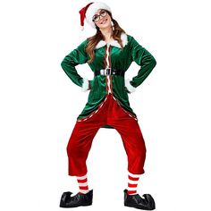 a woman in a green and red christmas suit with santa claus hat on her head