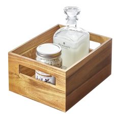 a wooden box with two jars and a bottle in it