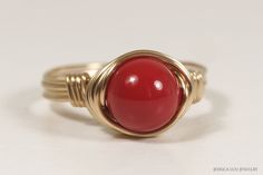 Red Coral Swarovski Pearl Ring Handmade by Jessica Luu Jewelry ~ Elegant ~ Classic ~ Simple ~ Have this red coral pearl solitaire ring made just for you - available in 14K rose and yellow gold filled. MATCHING ITEMS https://www.etsy.com/shop/JessicaLuuJewelry?search_query=red+coral+pearl DETAILS: ~ 8mm red coral Swarovski pearl ~ 14K yellow or rose gold filled wire HOW IT'S MADE: Each ring is handmade to order using U.S. standard jewelry sizing equipment to ensure the correct size with 14K gold Classic Adjustable Red Ring, Classic Coral Jewelry As Gift, Classic Coral Jewelry Gift, Red Adjustable Wire Wrapped Rings, Adjustable Red Wire Wrapped Rings, Elegant Handmade Red Rings, Elegant Handmade Red Ruby Ring, Elegant Red Ruby Ring For Jewelry Making, Elegant Red Pearl Ring For Anniversary