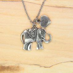 ♥ Silver Elephant charm Necklace Elephant charm Elephant Pendant Personalized Necklace Initial Charm Initial Necklace Customized Jewelry ♥ This is a beautiful elephant charm with hand stamped initial charm on a stainless steel chain, You able to choose initial from a drop down menu, ♥ You will receive 1 necklace ♥ Elephant charm 20x18 mm ♥ Initial charm 10 mm choose from a drop down menu ♥ Stainless steel chain 18 inches ♥ additional initial https://www.etsy.com/listing/766732811 ♥ We strive for Nickel Free Pendant Charm Necklace For Best Friend, Nickel-free Pendant Charm Necklaces For Best Friend Gift, Nickel-free Pendant Charm Necklace For Best Friend, Nickel-free Metal Charm Necklaces As Gift, Elephant Charm Necklace, Beautiful Elephant, Personalised Bangle, Silver Elephant, Silver Elephants