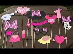 minnie mouse cupcake toppers and cake picks on a wooden table with pink polka dots