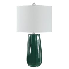 a green table lamp with a white shade