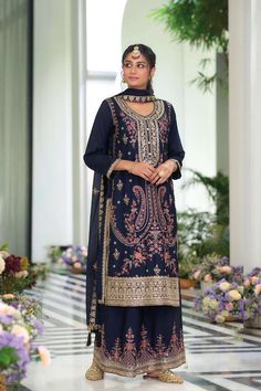 This Navy Chinon Silk Embroidered Palazzo Style Suit features intricate resham thread work, zari work, and sequence work throughout the kameez and palazzo. Embroidered chinnon palazzo bottom and top is lined with crape silk for added elegance and comfort. Included full size embroidered chinon silk dupatta. Traditional suit is perfect for formal events, such as parties, weddings, and special occasions. Premium chinon silk Kurta: Hevy chinon with emboidery work Palazzo: Hevy chinon with embroidery Phulkari Pants, Lucknowi Kurta, Patiala Salwar Suits, Bridal Dupatta, Traditional Suit, Palazzo Suit, Kurta Dress, Party Wear Lehenga, Navy Blue Fabric