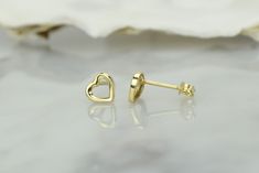 14k gold heart earrings, made with a delicate design and size. The smooth surface and lines give you a jewelry piece that will complete your outfit for work, leisure, or even special occasions. 💎Design: Delicate open heart earrings 💎Material: 14k solid gold and and a layer of E-Coating that acts as protection against tarnish and scratches ,which will keep your earring looking spotless 💎Earrings size: 6.2mm x 6.5mm The earrings come in a charming jewelry box. Additionally, you will also get a Yellow Gold Heart Pendant Earrings For Anniversary, Yellow Gold Open Heart Earrings For Wedding, Yellow Gold Open Heart Wedding Earrings, Minimalist 14k Gold Heart Earrings, Yellow Gold Open Heart Earrings For Anniversary, 14k Gold Pierced Heart Earrings For Wedding, Yellow Gold Heart Cut Earrings, Wedding 14k Gold Pierced Heart Earrings, Delicate Gold Hypoallergenic Heart Earrings