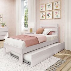 a white bed sitting in a bedroom on top of a hard wood floor