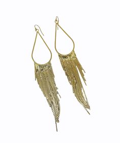 These long gold tassel earrings are lightweight, long, and chic. They shimmer, shine, and are perfect for day or night. A boho-chic pair of earrings for women.- gold or silver your choice.- 14k gold-filled or sterling silver ear wires your choice.- drop length of the earring is 5-7/8 inches {145mm}. - Your jewelry will come packaged for gift giving. Trendy Gold Fringe Earrings, Trendy Gold Tassel Earrings With Fringe, Elegant Fringe Metal Chandelier Earrings, Gold Metal Jewelry With Tassels, Gold Metal Tassel Jewelry, Elegant Metal Fringe Jewelry, Gold Metal Fringe Tassel Earrings, Metal Fringe Dangle Earrings, Fringe Dangle Metal Earrings