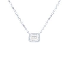 A single emerald cut diamond weighing 0.50 carats is held in a modern bezel setting with milgrain detail. Classic Emerald Cut Bezel Set Jewelry, Diamond White Emerald Cut Jewelry With Bezel Setting, Classic Emerald Cut Jewelry With Bezel Setting, Classic Jewelry With Emerald Cut Bezel Setting, Classic Jewelry With Baguette Diamonds In Rectangular Shape, Classic Octagon Jewelry With Baguette Diamonds, Classic Octagon Baguette Diamond Jewelry, Diamonds Direct, Emerald Cut Diamond